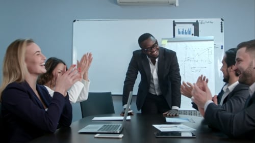 Energetic Office Staff Applaud Colleague's Presentation