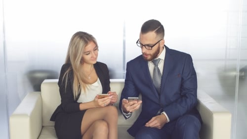 Young Businessmen Using Mobile Phone by Typing Contemporary Smartphone Screen