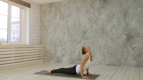 Woman Doing Yoga Flow on Yoga Mat