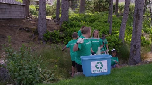 Group of volunteers cleaning up park