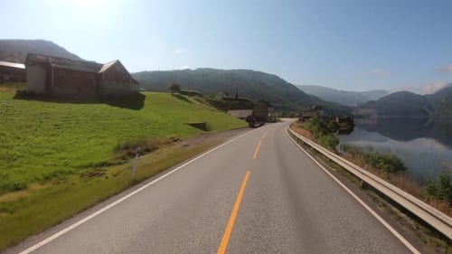 Vehicle Point-of-view Driving a Car on a Road in Norway
