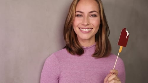 Smiling Woman Holds Popsicle Prop