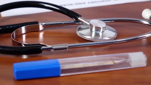 Doctor Puts Blue and Green Medical Pills, Cam Moves To the Right