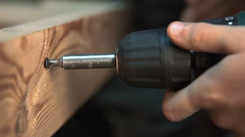 Using a Power Drill to Make a Hole in Wood