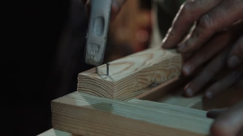 Hammer Nailing Wood Plank Frame Together Close Up