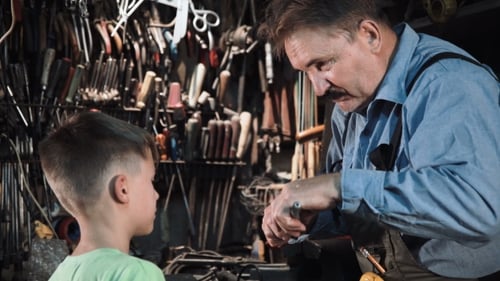 Grandpa Carpenter with His Grandson in the Workshop