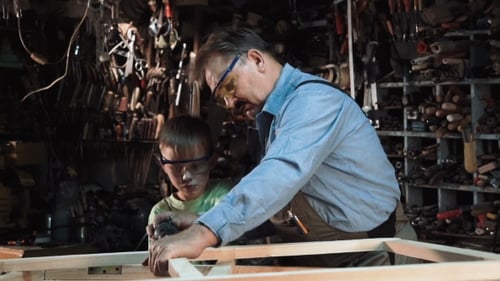 Woodworking Project with Adult and Child in Workshop