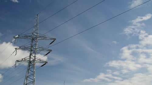 Power Transmission Line With Cloudy Sky On The Background