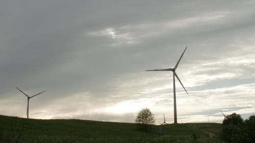 Wind Turbine Farm, Electric Power Generators on Field on Cloudy Sky Background