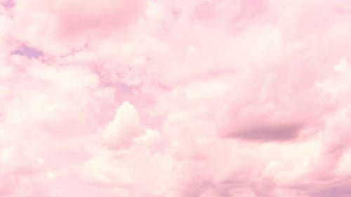 Pink Clouds Floating Gently Across Sky
