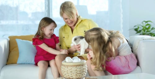 Family with Easter Rabbit in a Home Setting