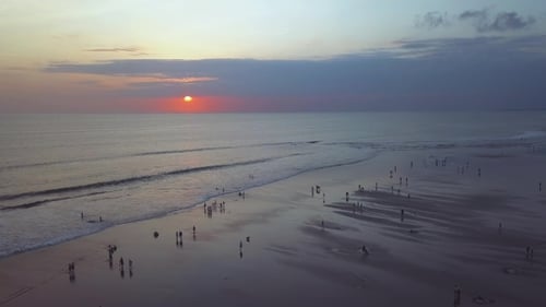 Beach Aerial View at Sunset with People