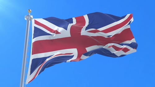 United Kingdom Flag Waving in Wind with Blue Sky