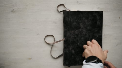 Mans Hands Open Handmade A4 Notebook with Real Leather Cover