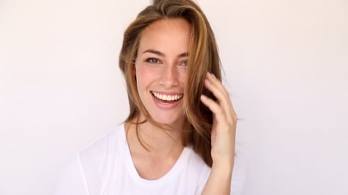 Young Woman Smiling and Posing for the Camera