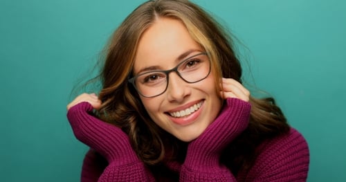 Smiling Woman Wearing Glasses and Burgundy Sweater