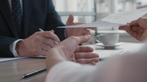 Hands of Unrecognizable People on Interview