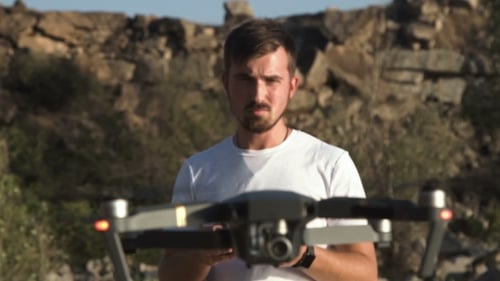 Man Controlling Drone with Rc.