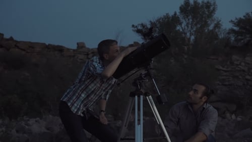 People Using Telescope in Dawn