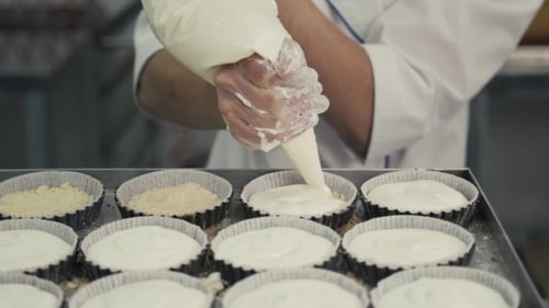 Chef in Rubber Gloves Preparing Vanilla Cake