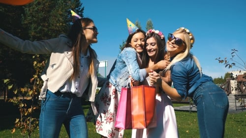 Young Women Celebrate Birthday in Urban Park