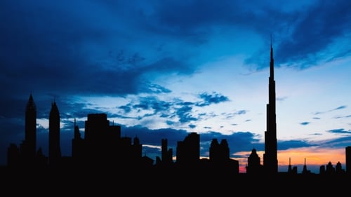 Dubai Cityscape Silhouette on Sunset in UAE