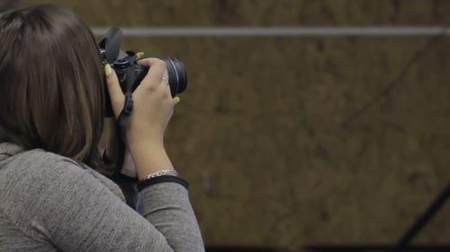 Woman Photographer Is Taking Images with Dslr Camera