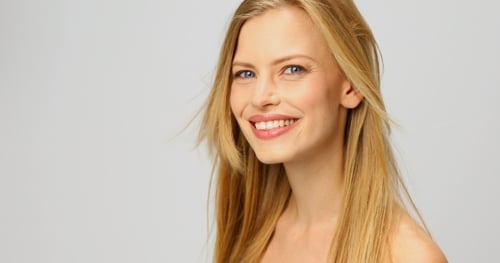 Attractive Blonde Woman Smiling with Flowing Hair