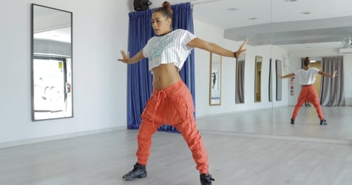 Expressive Woman Dancing in Studio