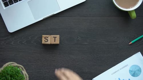Startup Blocks on a Wooden Desk, Overhead View