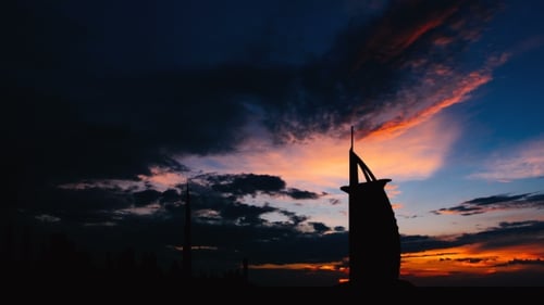 Dubai Cityscape Silhouette on Sunset in UAE