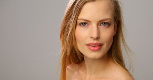 Beautiful Woman Turns Her Head in Studio Close Up