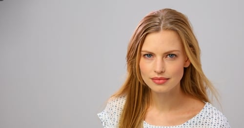 Portrait of Young Blonde Woman Looking at Camera