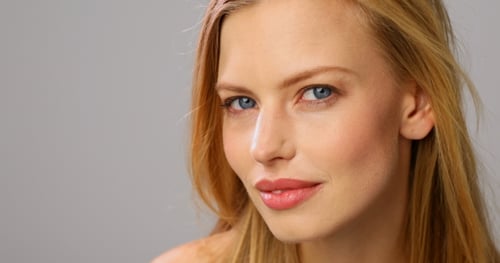 Beautiful Woman Posing Elegantly in Studio