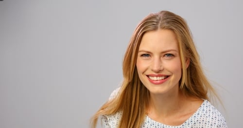 Beautiful Blonde Woman Smiling Close-up in Studio