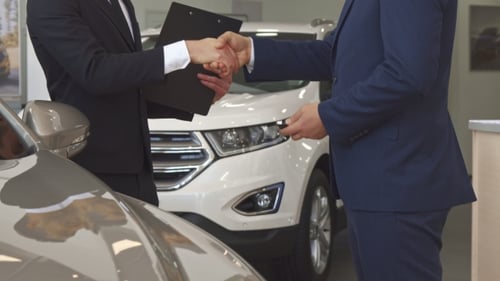 Sales Manager Sells Car To the Customer at the Dealership