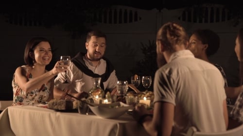 Friends Toasting Wine at an Outdoor Dinner Party