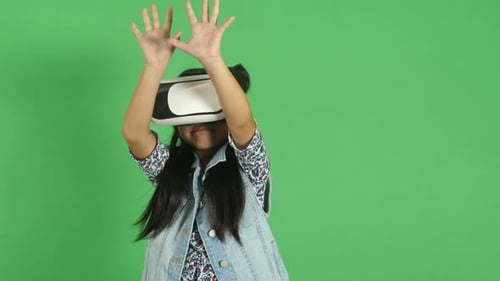 Little Girl Exploring Virtual Reality. Green Screen