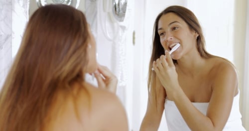 Girl Brushing Teeth in Morning