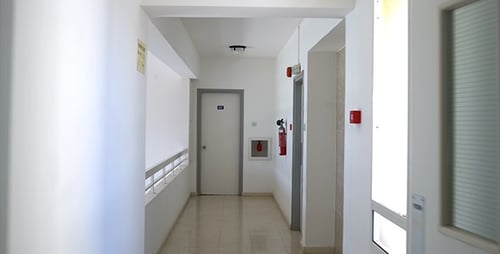 Bright Institutional Hallway with Dolly Shot