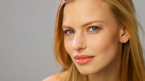 Beautiful Woman with Fair Hair Smiling Gently