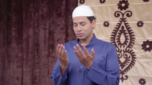 Man Praying Faithfully Indoors
