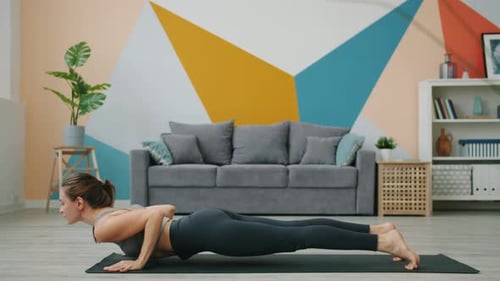 Attractive Woman Doing Yoga Workout at Home