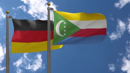 Flags Waving: Germany and Comoros National Flags on Poles