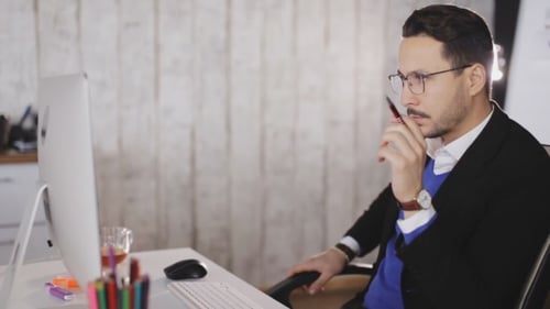 Сoncentrated Man Work with Computer in the Office