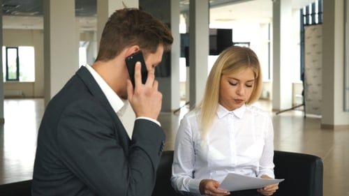 Business Meeting in Office Two Business People Discussing Contract