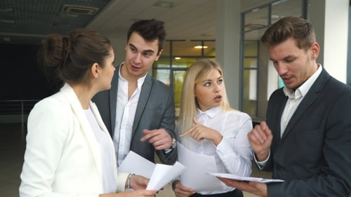 Office Team Reviewing Documents Collaboratively