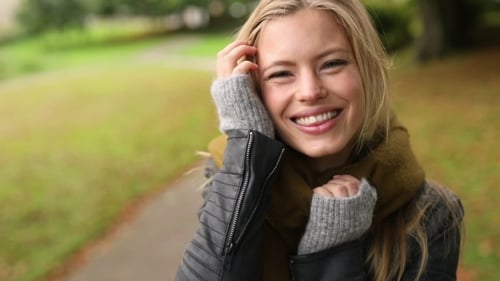 Woman Smiling Outdoors in Autumn Close Up