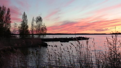 Scenic Lake at Sunset with Dramatic Sky