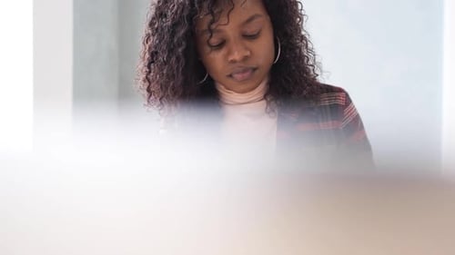 Focused Young Woman Working Hard in Office